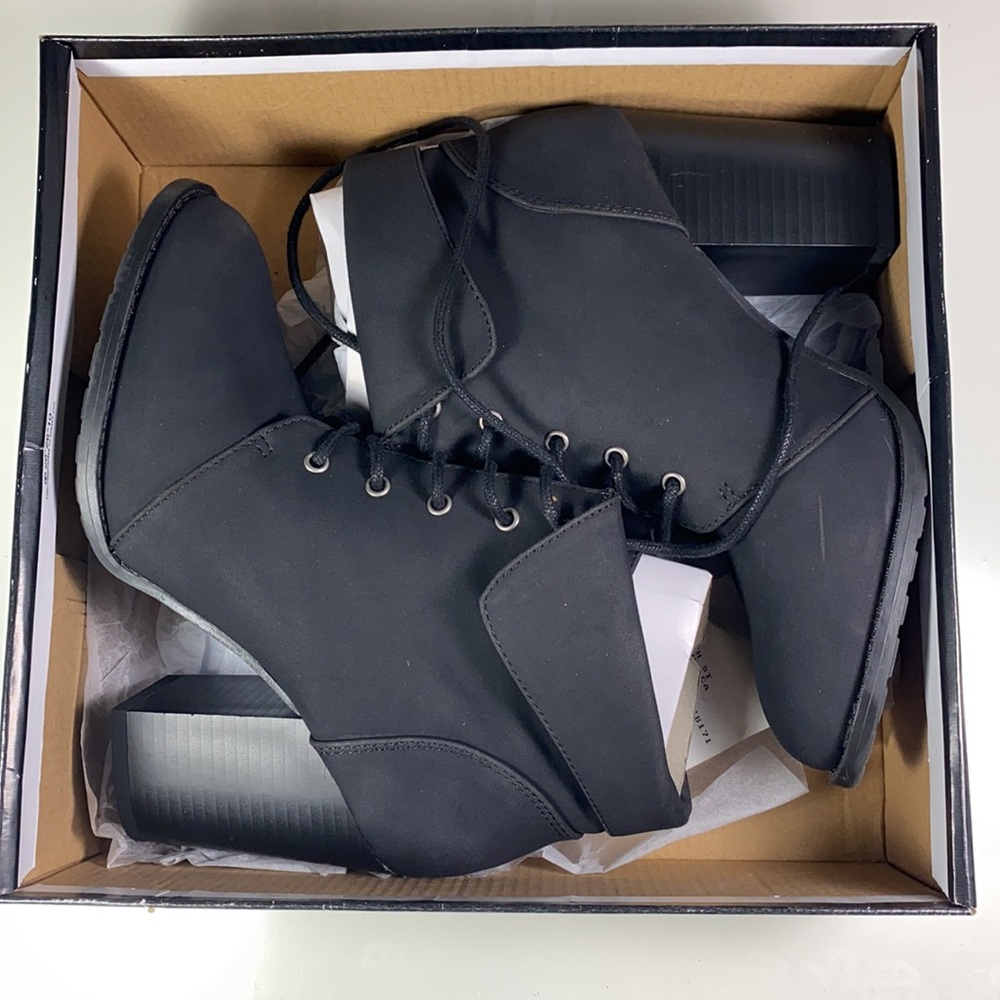 Black lace up heeled booties.